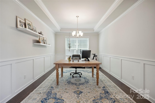 13339 Mcguffy Dr, Huntersville, NC 28078 - home office featuring dark wood-style flooring, a chandelier, a tray ceiling, crown molding, and a wainscoted wall