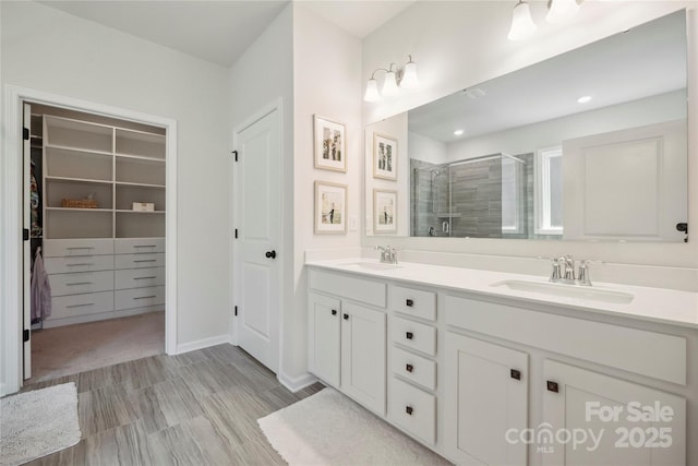 13339 Mcguffy Dr, Huntersville, NC 28078 - full bathroom with a shower stall, double vanity, and a spacious closet