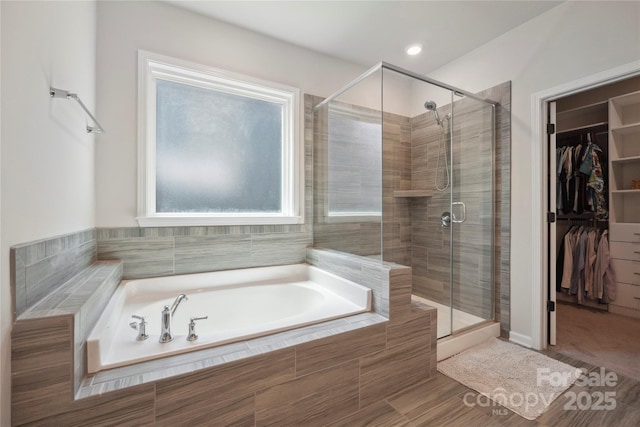 13339 Mcguffy Dr, Huntersville, NC 28078 - full bathroom with a bath, a stall shower, and a spacious closet