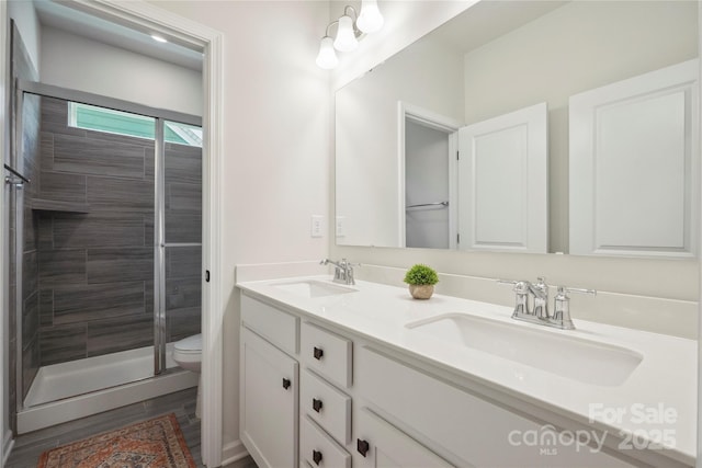 13339 Mcguffy Dr, Huntersville, NC 28078 - bathroom with double vanity and a stall shower
