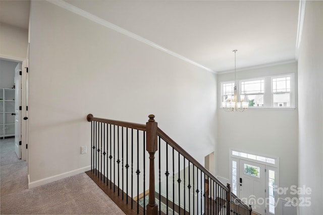 13339 Mcguffy Dr, Huntersville, NC 28078 - stairway with a chandelier, crown molding, and carpet