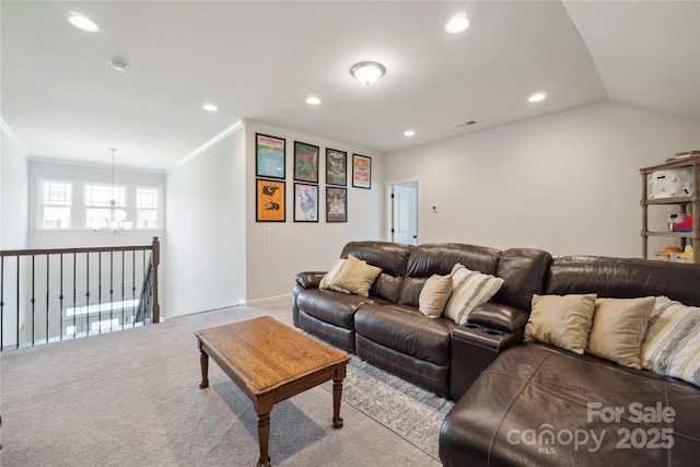 13339 Mcguffy Dr, Huntersville, NC 28078 - carpeted living room featuring a chandelier, ornamental molding, recessed lighting, and vaulted ceiling