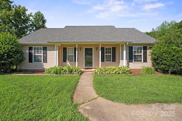121 Gilcrest Ln, Troutman, NC 28166 - view of front of property with covered porch, a front yard, and roof with shingles