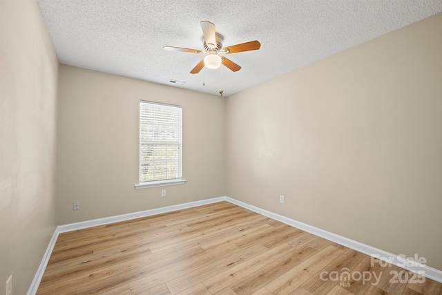 121 Gilcrest Ln, Troutman, NC 28166 - spare room featuring a ceiling fan, a textured ceiling, and light wood-type flooring