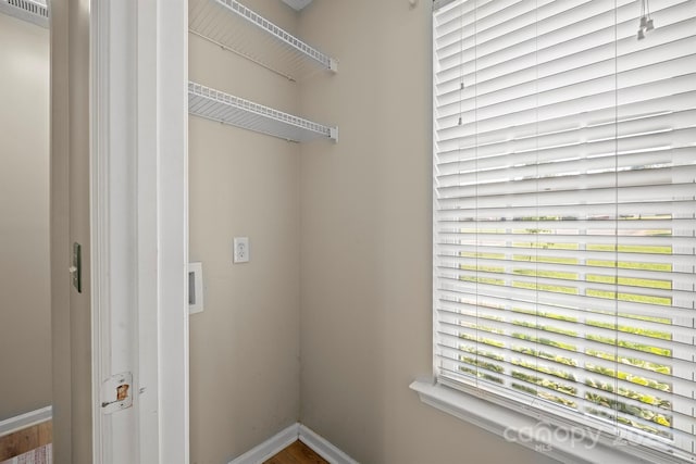 121 Gilcrest Ln, Troutman, NC 28166 - washroom featuring baseboards and wood finished floors
