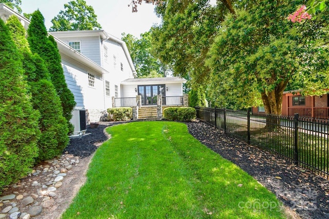 711 Yadkin St, Albemarle, NC 28001 - view of yard with french doors and a wooden deck