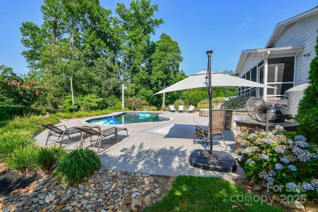711 Yadkin St, Albemarle, NC 28001 - swimming pool featuring a sunroom and a patio area