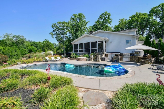 711 Yadkin St, Albemarle, NC 28001 - outdoor pool featuring exterior kitchen, a sunroom, a patio area, and stairway