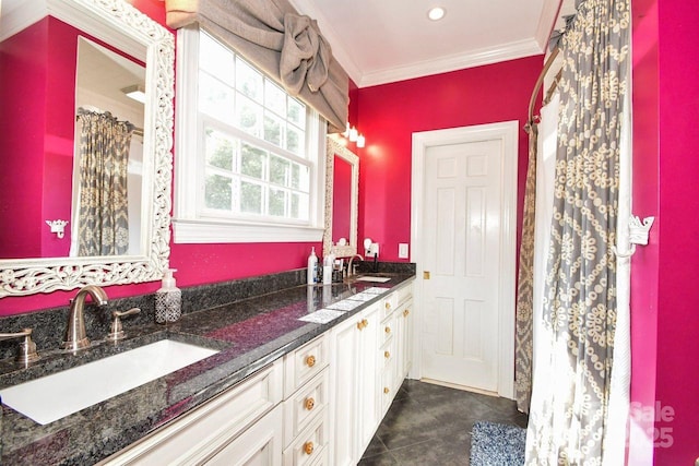 711 Yadkin St, Albemarle, NC 28001 - bathroom featuring double vanity, crown molding, and tile patterned floors