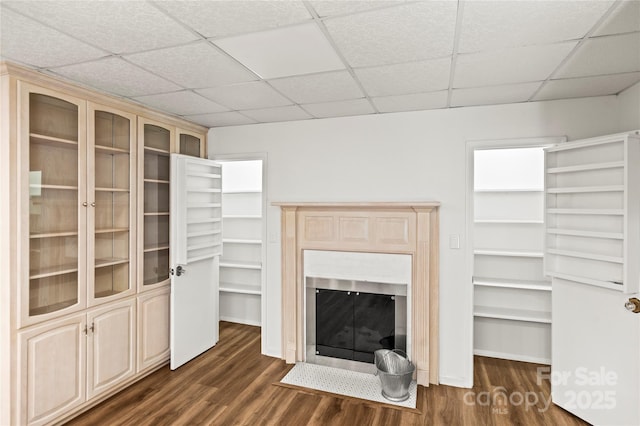 2028 Old Latter Rd, Newton, NC 28658 - unfurnished living room with dark wood-style floors, a paneled ceiling, and a fireplace with flush hearth