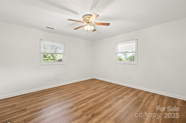2028 Old Latter Rd, Newton, NC 28658 - spare room with healthy amount of natural light, wood finished floors, and ceiling fan