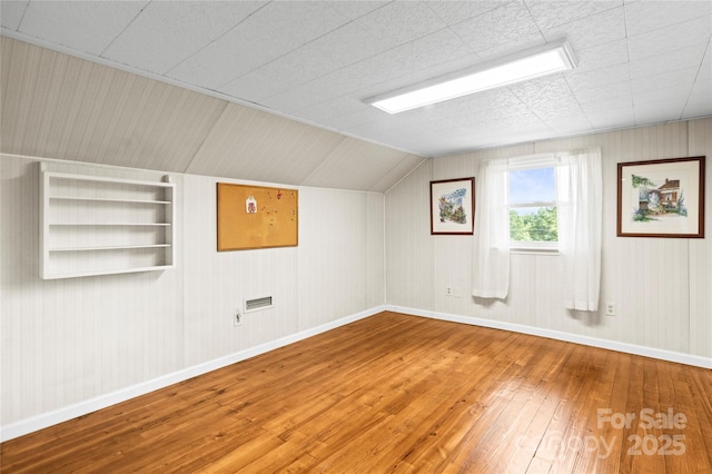 2028 Old Latter Rd, Newton, NC 28658 - additional living space with hardwood / wood-style floors, built in shelves, and vaulted ceiling