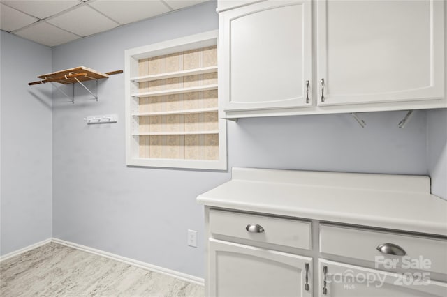 2028 Old Latter Rd, Newton, NC 28658 - laundry area with wood finished floors and baseboards