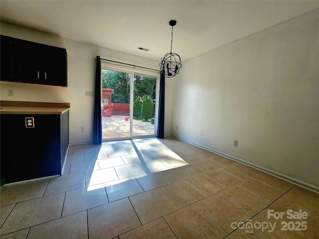 3108 Leicester Dr, Matthews, NC 28104 - unfurnished dining area with a chandelier and light tile patterned floors