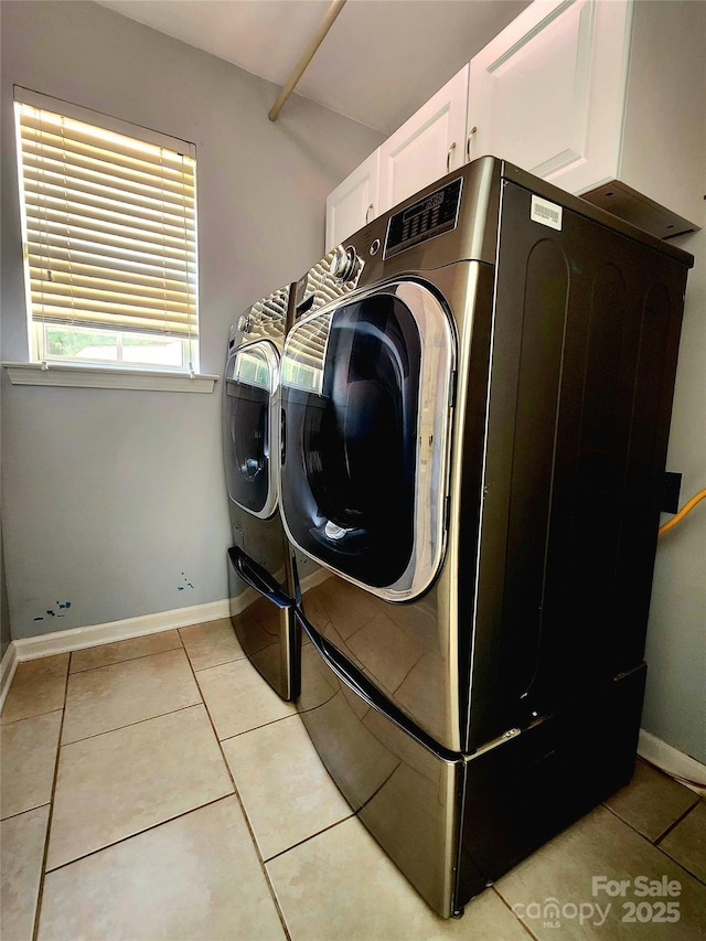 3108 Leicester Dr, Matthews, NC 28104 - washroom featuring cabinet space, independent washer and dryer, and light tile patterned floors