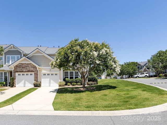 621 Pine Links Dr, Tega Cay, SC 29708 - view of front facade featuring a front yard, driveway, stone siding, and a garage