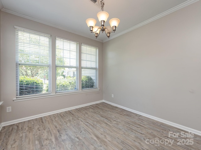 621 Pine Links Dr, Tega Cay, SC 29708 - unfurnished room with healthy amount of natural light, a chandelier, wood finished floors, and crown molding