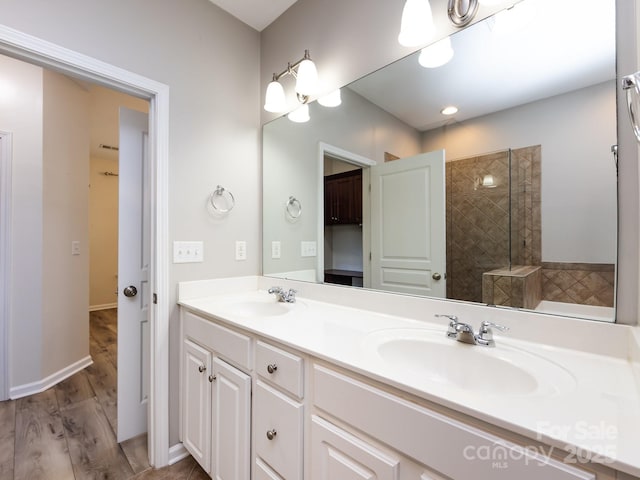 621 Pine Links Dr, Tega Cay, SC 29708 - bathroom featuring double vanity and wood finished floors