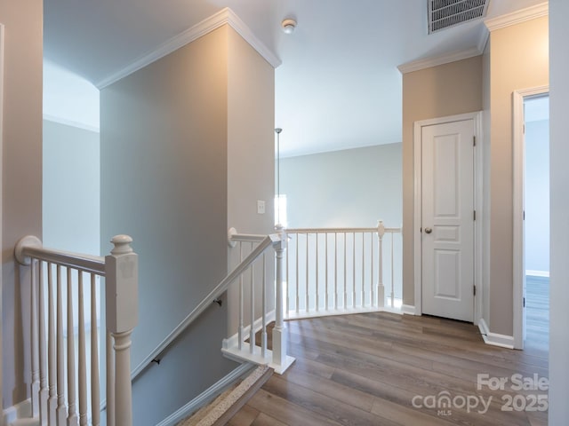 621 Pine Links Dr, Tega Cay, SC 29708 - hall with an upstairs landing, wood finished floors, and ornamental molding