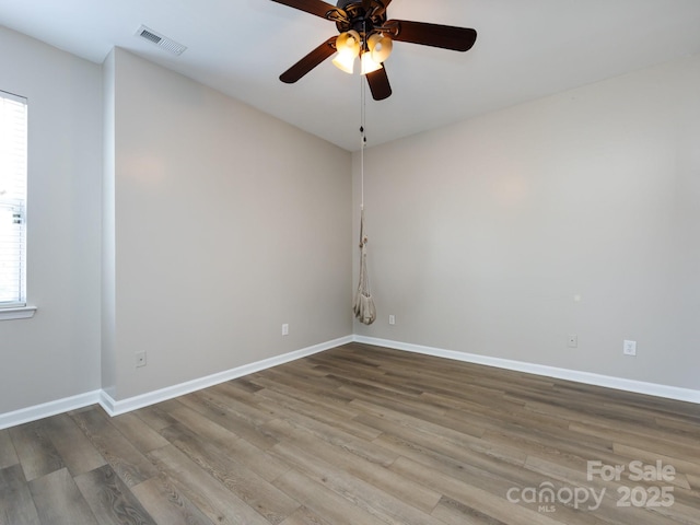 621 Pine Links Dr, Tega Cay, SC 29708 - empty room with ceiling fan and wood finished floors