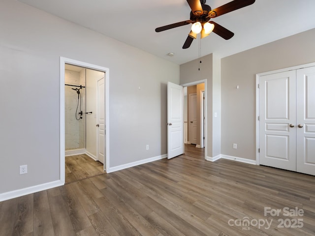 621 Pine Links Dr, Tega Cay, SC 29708 - unfurnished bedroom featuring wood finished floors, ensuite bath, and ceiling fan