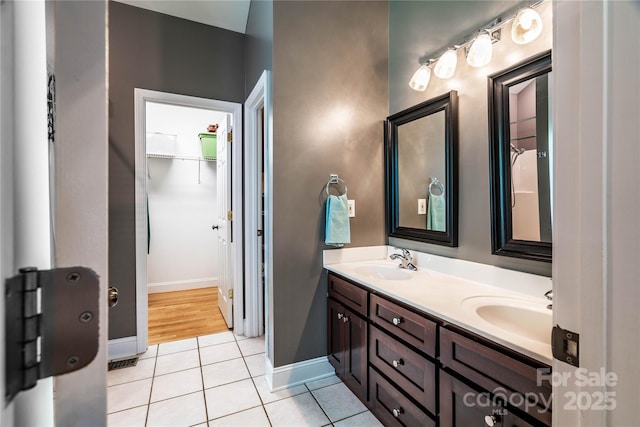 2124 Congress Ct, Kannapolis, NC 28083 - full bath featuring double vanity, tile patterned flooring, and a walk in closet