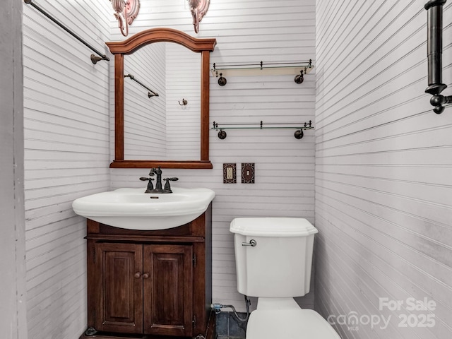 1111 Bills Creek Rd, Lake Lure, NC 28746 - half bathroom featuring vanity and wooden walls