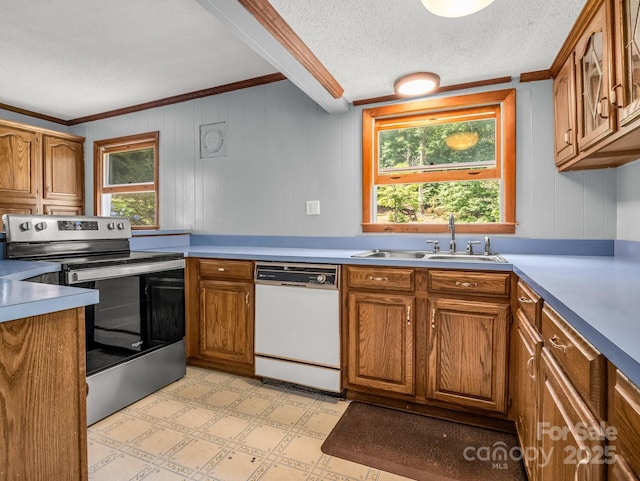 1111 Bills Creek Rd, Lake Lure, NC 28746 - kitchen with dishwasher, electric stove, brown cabinetry, ornamental molding, and wood walls