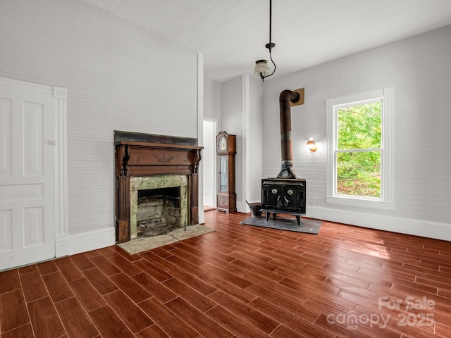 1111 Bills Creek Rd, Lake Lure, NC 28746 - unfurnished living room with a wood stove, dark wood finished floors, and a fireplace