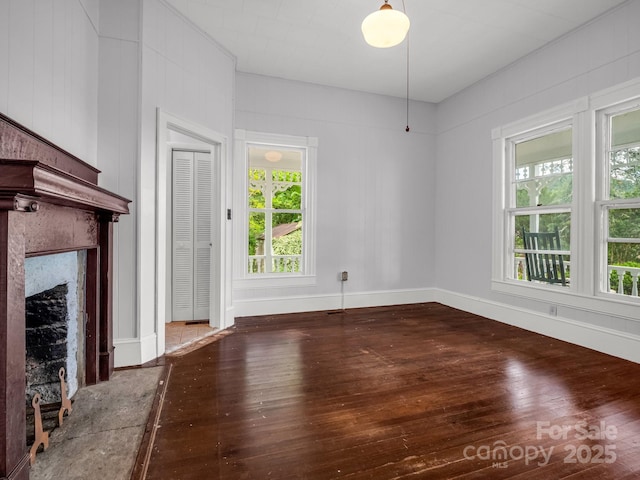 1111 Bills Creek Rd, Lake Lure, NC 28746 - unfurnished living room featuring hardwood / wood-style floors and a high end fireplace