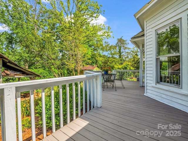 1111 Bills Creek Rd, Lake Lure, NC 28746 - wooden terrace with outdoor dining space