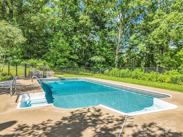 1111 Bills Creek Rd, Lake Lure, NC 28746 - view of swimming pool with a patio, grilling area, view of wooded area, and a diving board