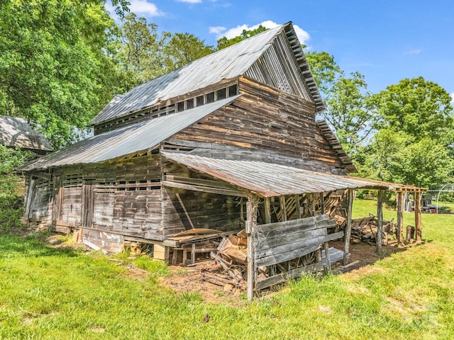 1111 Bills Creek Rd, Lake Lure, NC 28746 - view of side of property featuring a barn, an outbuilding, a metal roof, and a lawn