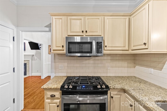 3535 Selwyn Farms Ln, Charlotte, NC 28209 - kitchen with appliances with stainless steel finishes, wood finished floors, ornamental molding, light stone counters, and decorative backsplash