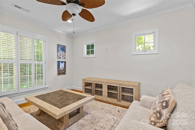 3535 Selwyn Farms Ln, Charlotte, NC 28209 - living area featuring healthy amount of natural light, crown molding, a ceiling fan, and wood finished floors