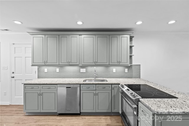 11401 Lone Star Cir, Charlotte, NC 28226 - kitchen featuring stainless steel appliances, open shelves, gray cabinetry, light wood finished floors, and recessed lighting