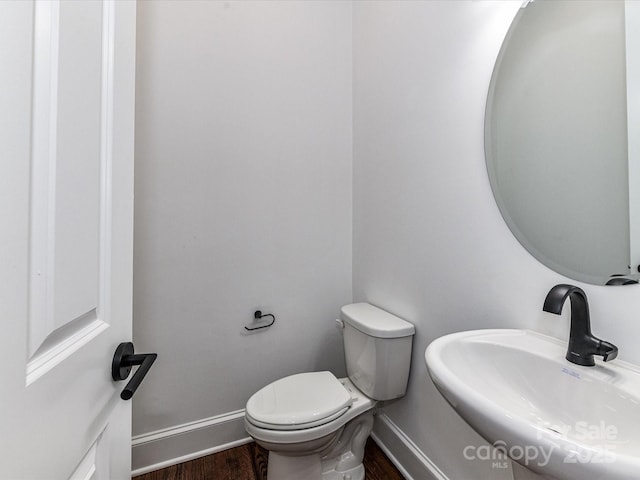 344 S Laurel Ave, Charlotte, NC 28207 - half bathroom with a sink and wood finished floors