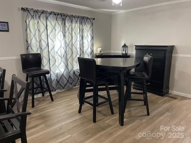 25 Mountain View Rdg, Fairview, NC 28730 - dining space featuring light wood-style floors and ornamental molding
