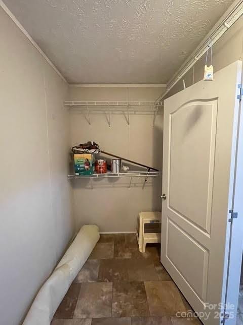 25 Mountain View Rdg, Fairview, NC 28730 - walk in closet featuring stone finish flooring
