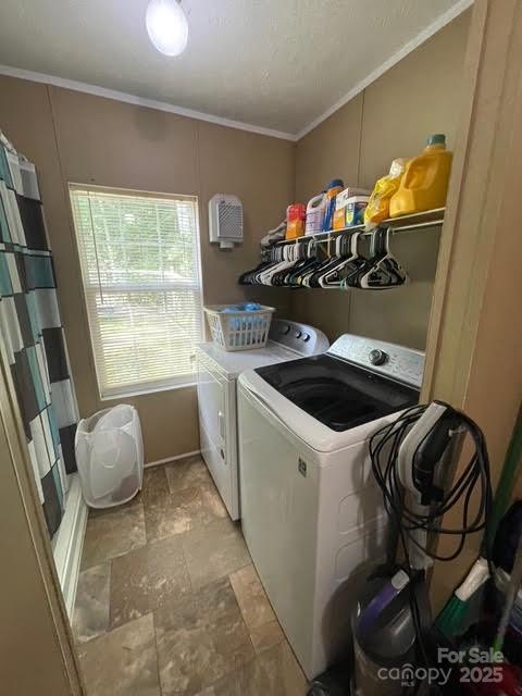 25 Mountain View Rdg, Fairview, NC 28730 - laundry room featuring washer and clothes dryer, stone finish flooring, and ornamental molding