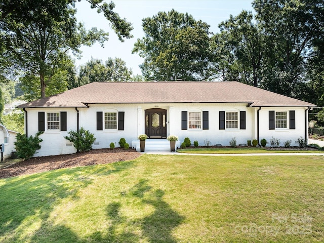 6745 Lancer Dr, Charlotte, NC 28226 - single story home featuring a front lawn, a shingled roof, and brick siding