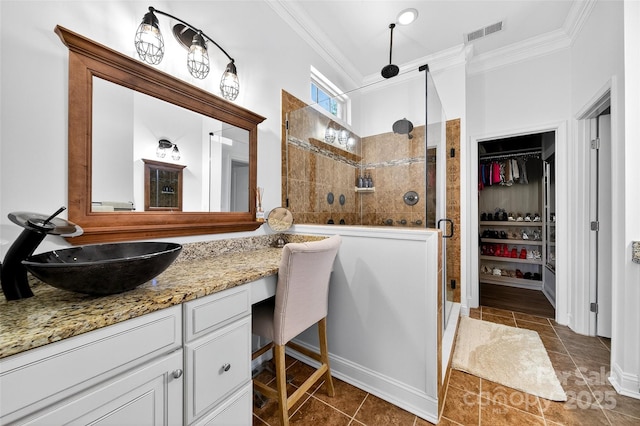 3981 Spinnaker Pl, Denver, NC 28037 - full bathroom featuring crown molding, a shower stall, vanity, a spacious closet, and tile patterned flooring