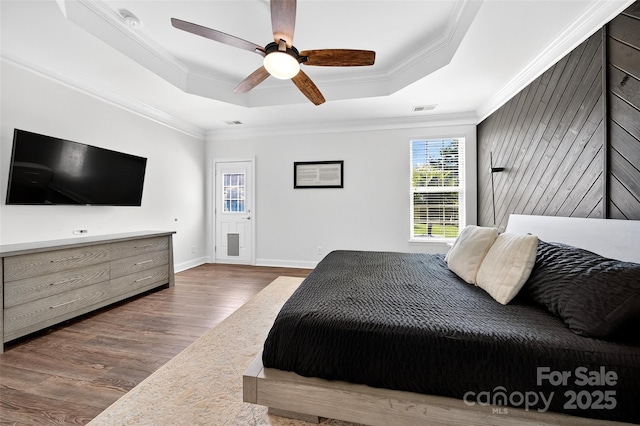3981 Spinnaker Pl, Denver, NC 28037 - bedroom featuring a raised ceiling, wood finished floors, crown molding, and ceiling fan