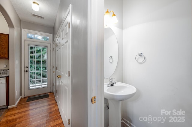 7518 Silver Arrow Dr, Charlotte, NC 28273 - bathroom featuring wood finished floors and a textured ceiling