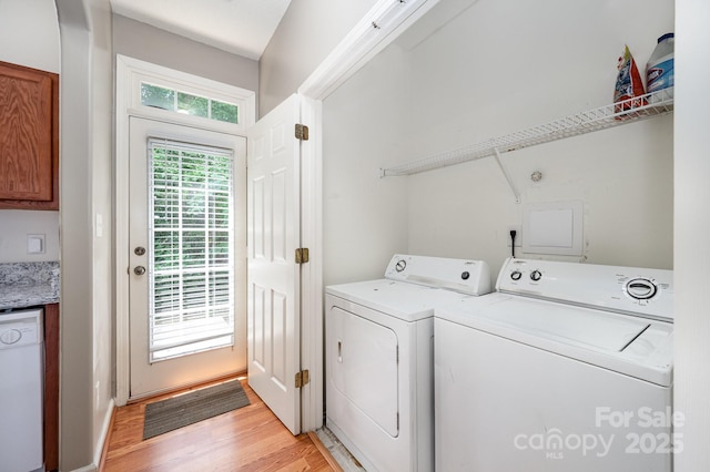 7518 Silver Arrow Dr, Charlotte, NC 28273 - laundry area with washing machine and clothes dryer and light wood-type flooring