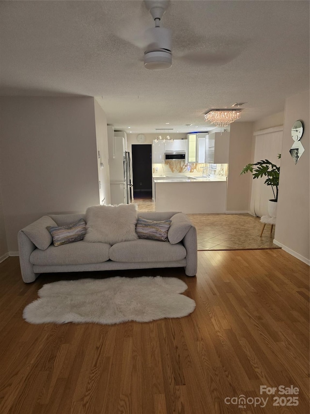 3 Hidden Sands Ct, Columbia, SC 29229 - living area featuring wood finished floors and a textured ceiling