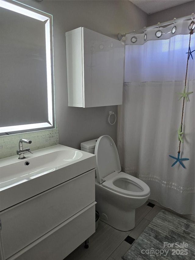 3 Hidden Sands Ct, Columbia, SC 29229 - bathroom featuring vanity, decorative backsplash, and curtained shower