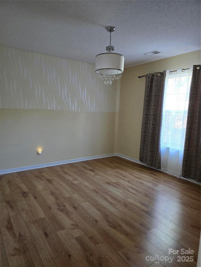 3 Hidden Sands Ct, Columbia, SC 29229 - empty room featuring hardwood / wood-style flooring and a textured ceiling
