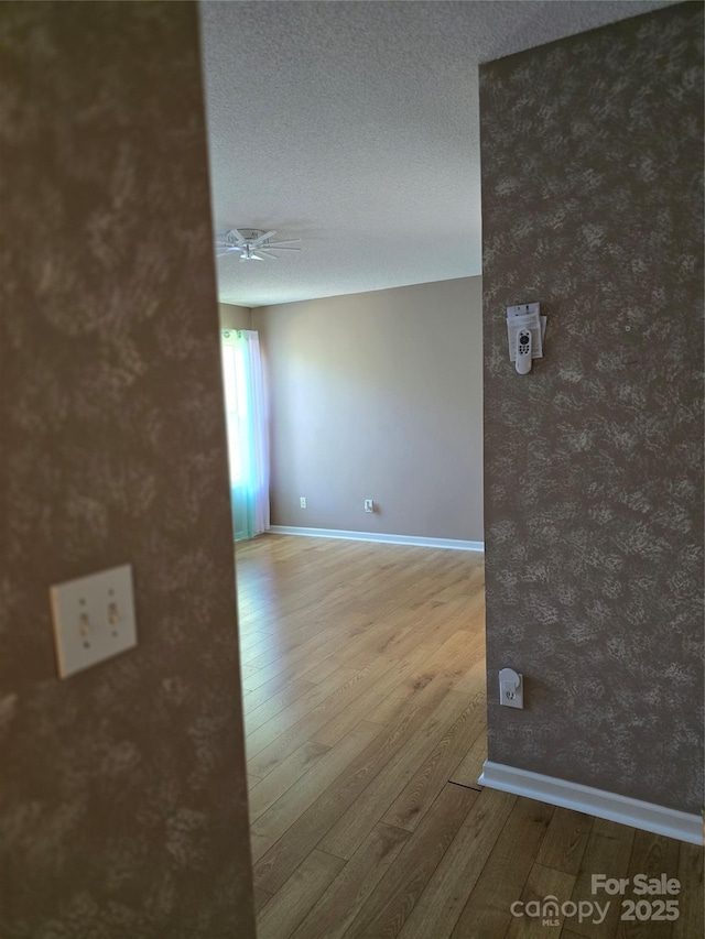 3 Hidden Sands Ct, Columbia, SC 29229 - empty room featuring wood finished floors, a ceiling fan, and a textured ceiling