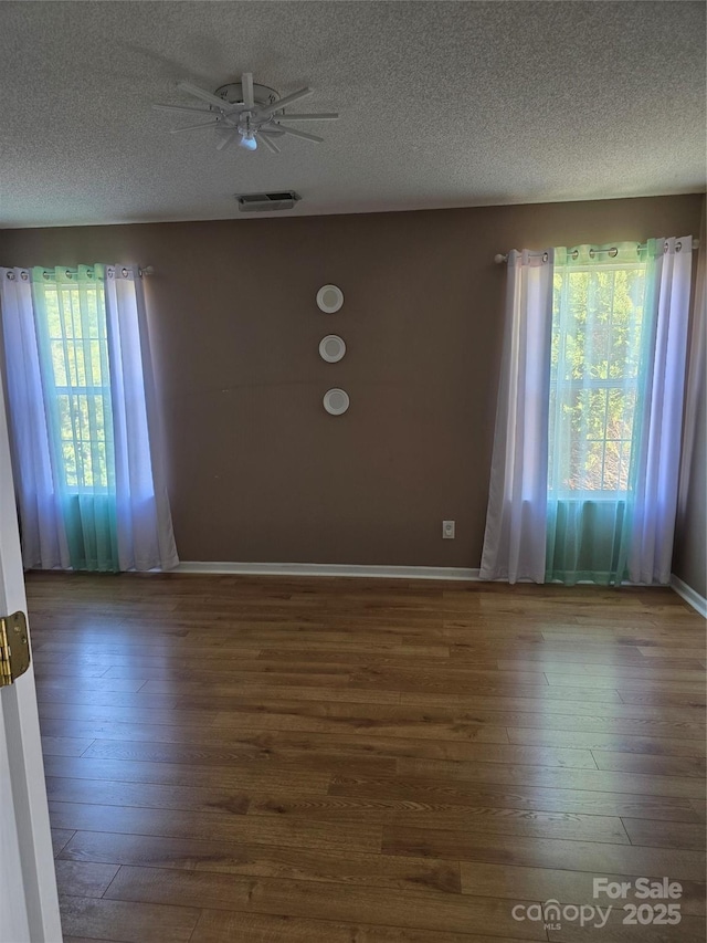 3 Hidden Sands Ct, Columbia, SC 29229 - spare room with hardwood / wood-style floors, a textured ceiling, and a ceiling fan